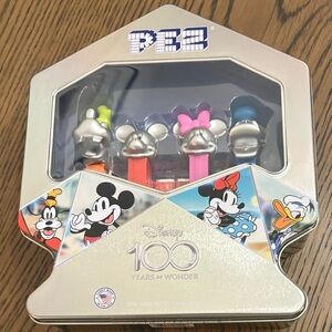 Disney 100 Years of Wonder- PEZ
Collectors Tin - 4 Dispensers And Pez
Included